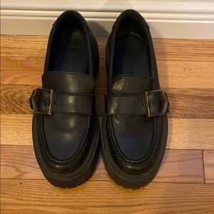 Floyd black platform shoes.